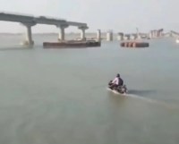 Man riding motorcycle on water