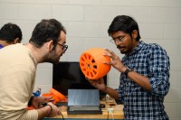 Robot that can jump, roll, swim and fly