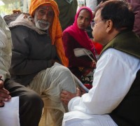 Energy Minister Pradyuman Singh Tomar sat on the ground during a public hearing
