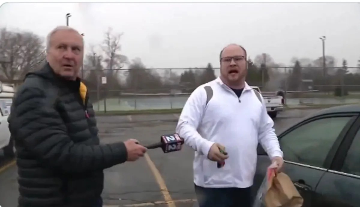 Man misbehaving with reporter