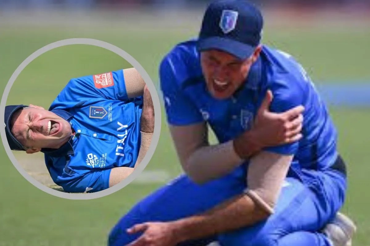 Injured Italy cricketer Wayne Madsen holding his shoulder in pain at Eden Gardens. italy-captain-wayne-madsen-injury-t20-world-cup-2026