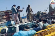 High-voltage drama at Badi Chaupar in Jaipur Man climbs car roof smokes and demands ban on bidi-cigarettes