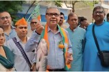 BJP leader campaigning holding a fish in his hand