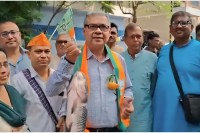 BJP leader campaigning holding a fish in his hand