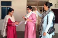 The State Eligibility Test was conducted under tight security, and people were made to remove their shoes and socks outside.