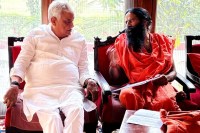 Dr. Kirodi Lal Meena with Baba Ramdev