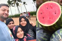 Family selfie with watermelon slice.