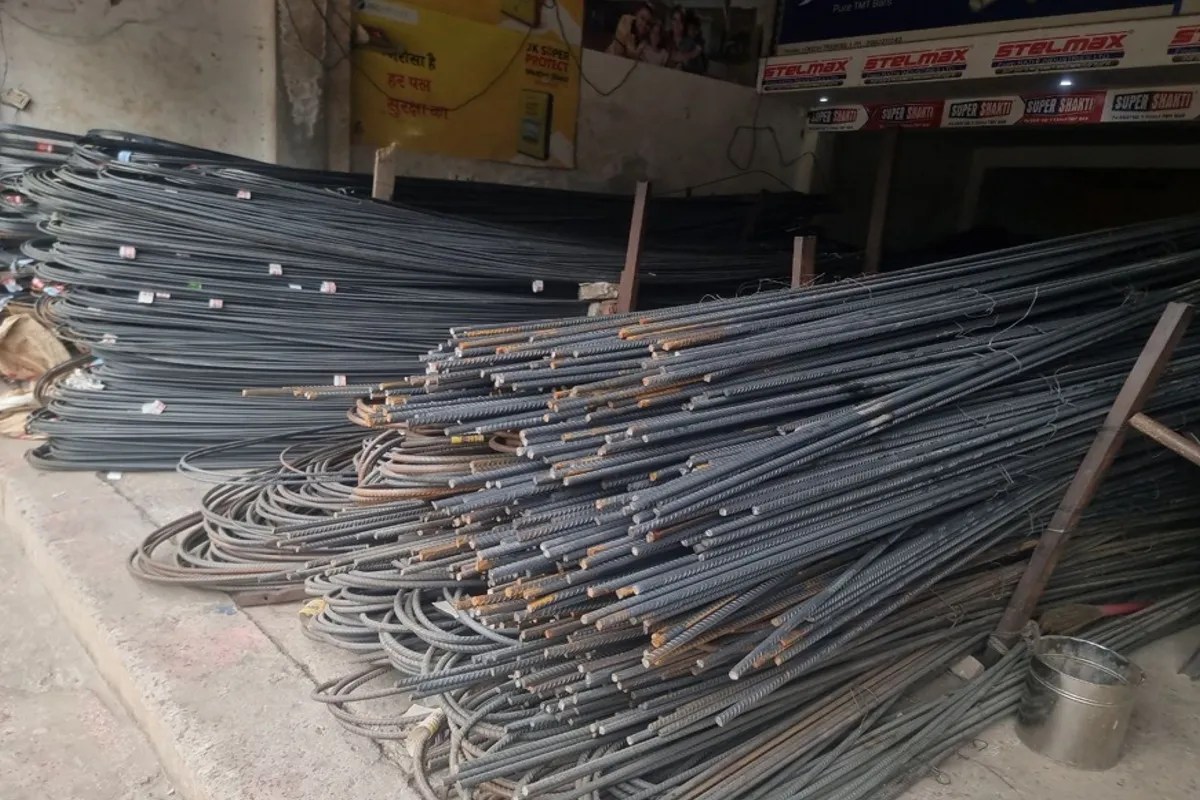 construction material price hike, steel price surge Rajasthan, Tonk market inflation news, iron price increase India, building cost rise 2026, metal price hike local market, supply chain disruption impact, home construction cost increase, plastic product price rise, aluminium steel rate hike, Rajasthan local market news, inflation impact middle class, construction industry crisis, raw material shortage India, Tonk business news