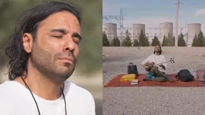 Iranian artist Ali Ghamsari performs in front of power plant