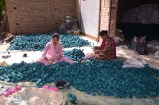 Women workers engaged in production activities at a factory in Sri Ganganagar.