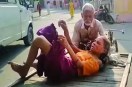 video from bareilly district hospital goes viral showing elderly man carrying sick wife on rickshaw