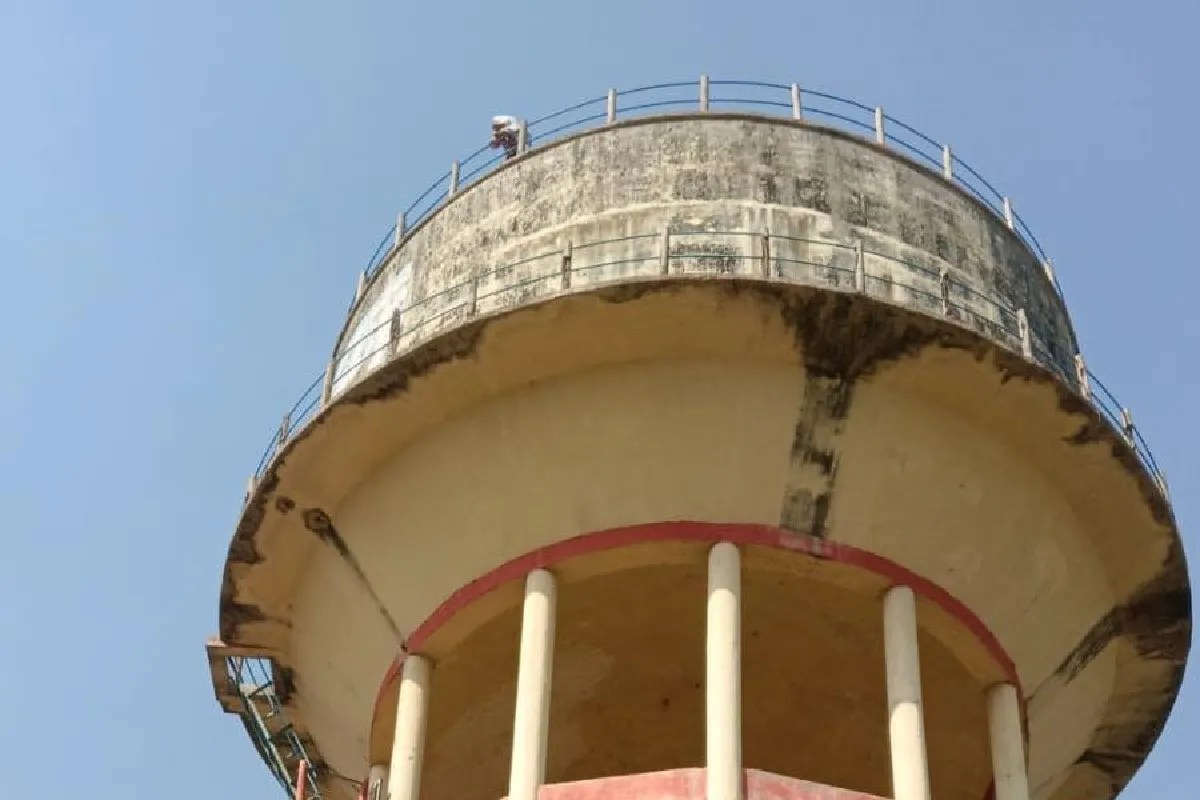 Girl climb on water tank