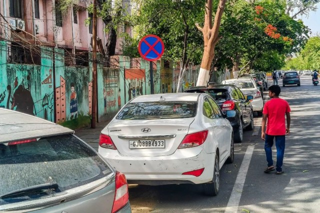 Vehicles parked on footpath