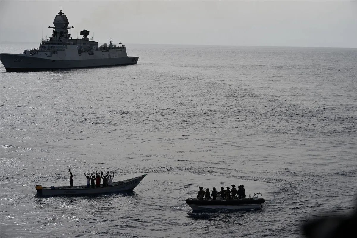 INS Kolkata and its helicopter intercepting suspected pirate activity near MV Mashallah 1.