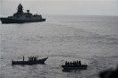 INS Kolkata and its helicopter intercepting suspected pirate activity near MV Mashallah 1.