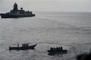 INS Kolkata and its helicopter intercepting suspected pirate activity near MV Mashallah 1.