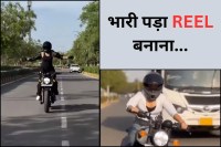 Girl performing Statue of Liberty pose on moving Bullet bike in Jaipur