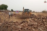 Bulldozer Action on Illegal Plotting