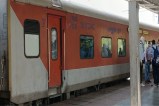 Due to the coach being closed, passengers have to run and board another coach.