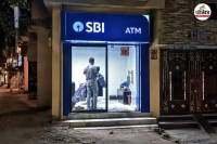 viral video of hair cutting saloon inside sbi atm booth