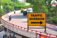 Traffic diversion sign placed on Bareilly flyover during route change advisory.