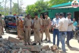 Workers trapped under collapsed beam debris