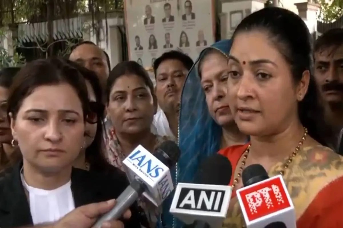 Alka Lamba speaking to media outside Rouse Avenue Court
