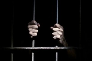 AI surveillance in UK prisons with robotics and microchip monitoring concept.