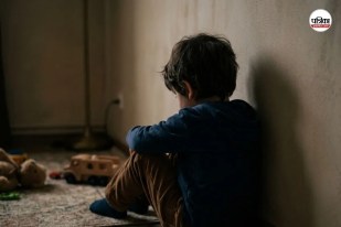 Child sitting alone, looking distressed.