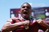 Boualem Khoukhi celebrates Qatar's late equaliser against Switzerland