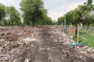Assurances regarding the construction of a road to the railway goods shed have proven hollow; vehicles continue to pass through the colony.