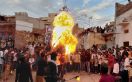 Breathing fire from the mouth during the *akhada* procession on Muharram.