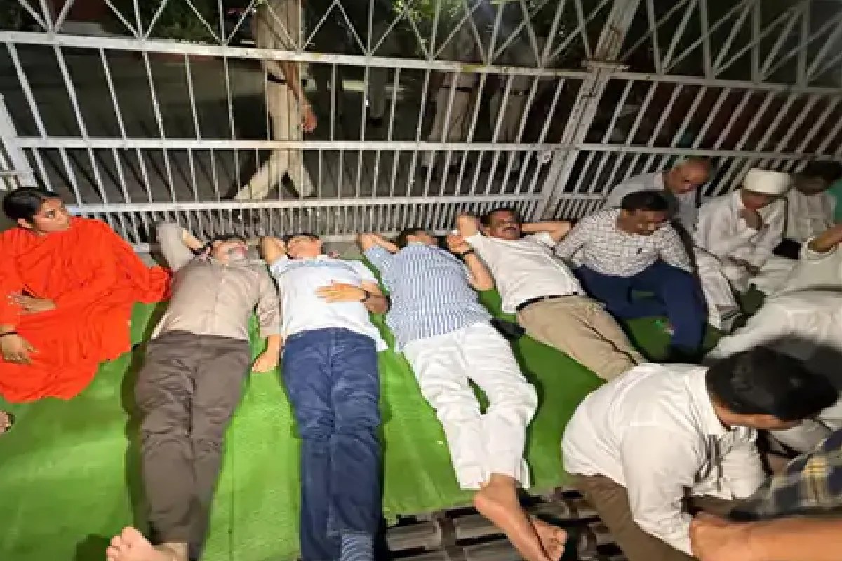 Jitu Patwari and Umang Singhar lay on the road in Bhopal