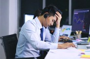 Indian man stressed over finances and bills.