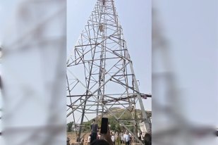 youth climbs mobile tower