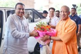 CM Yogi welcoming Nitin Gadkari