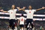 Soccer players celebrating a goal