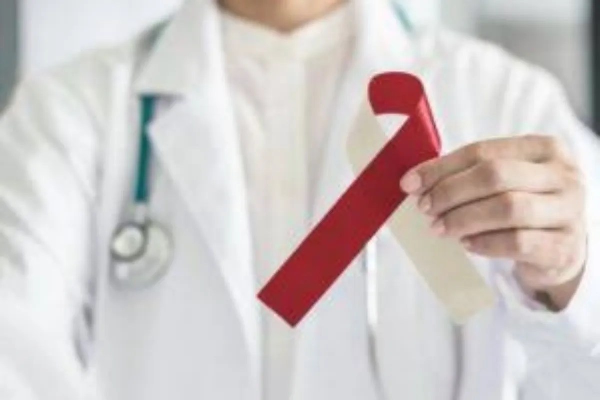 Doctor holding cancer ribbon