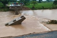 Bridge washed away in heavy rain