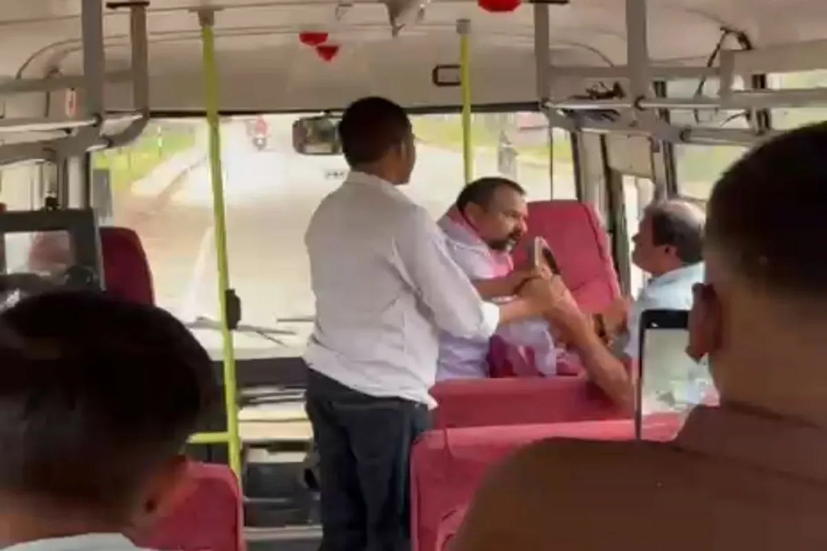 Security guard pointing gun on Bus driver