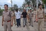 IPS son's beaten accused rally in city
