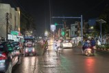 Busy street at night with vehicles