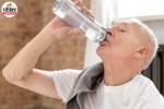drinking water to stay hydrated and avoid age-related dehydration risks