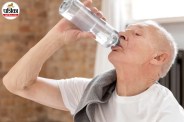 drinking water to stay hydrated and avoid age-related dehydration risks