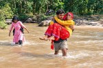 Woman across river in lap