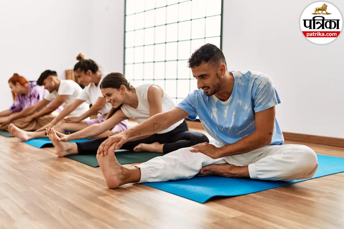 A qualified yoga therapist guiding a person through gentle stretching exercises for holistic healing