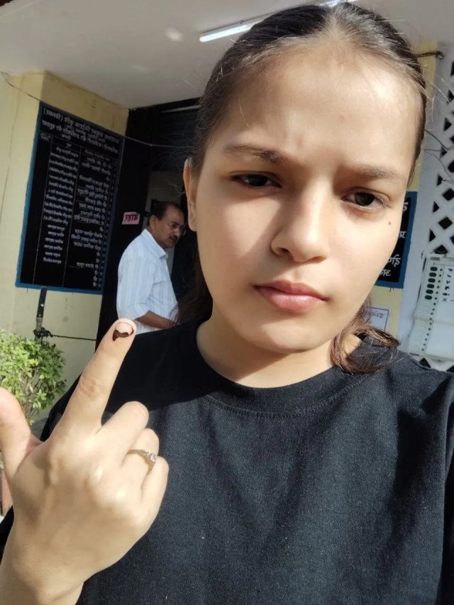 A young woman voting for the first time