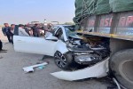 Electric Car Crashes into Rear of Truck; Child and Woman Killed