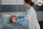 Doctor checking patient on ventilator in ICU for brain death diagnosis