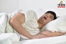 Adult experiencing drooling while sleeping on a wet pillow representing Sialorrhea causes